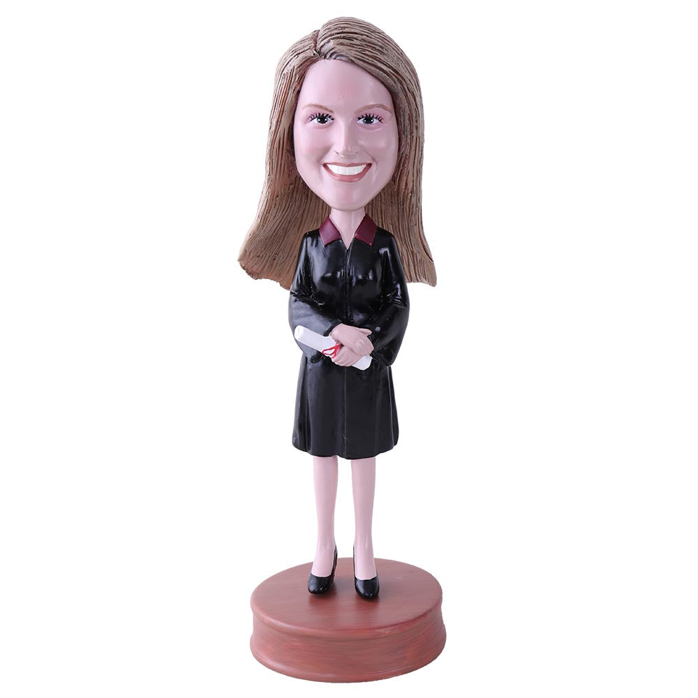 Female Graduate holding Diploma